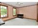 Bedroom featuring two windows, a ceiling fan, and peach colored walls at 6567 Kings Ct, Avon, IN 46123