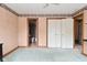 Bedroom view of an ensuite bathroom and closet with folding doors at 6567 Kings Ct, Avon, IN 46123