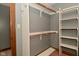 Walk-in closet with rods for hanging clothes and shelving at 6567 Kings Ct, Avon, IN 46123