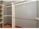 Empty closet with rods for hanging clothes and shelving at 6567 Kings Ct, Avon, IN 46123
