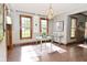 Dining room with natural light, wood trim, and a vintage chandelier at 6567 Kings Ct, Avon, IN 46123