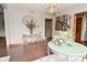Dining room featuring a vintage chandelier, wall art, and wood trim at 6567 Kings Ct, Avon, IN 46123