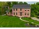 Charming two-story brick home featuring a well-maintained yard with a cozy walkway to the front entrance at 6567 Kings Ct, Avon, IN 46123