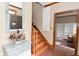 Foyer with wooden stairs, mirror and decorated chest at 6567 Kings Ct, Avon, IN 46123