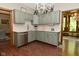 Charming kitchen with gray cabinets, stainless steel appliances, and tiled backsplash at 6567 Kings Ct, Avon, IN 46123