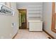 Spacious laundry room with white cabinets, shelves, and decor at 6567 Kings Ct, Avon, IN 46123