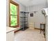 Functional laundry room with shelving and a large window providing natural light at 6567 Kings Ct, Avon, IN 46123