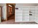 Open office with built-in shelving and adjacent doorway at 6567 Kings Ct, Avon, IN 46123