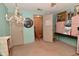 Room featuring unique decor, including a large decorative clock and vintage chandelier for a distinctive touch at 6567 Kings Ct, Avon, IN 46123