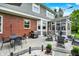 Cozy backyard patio area with a grill, dining table, and fire pit, perfect for outdoor gatherings at 7248 River Birch Ln, Indianapolis, IN 46236