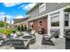 Backyard patio with a comfortable fire pit surrounded by chairs, ideal for relaxing evenings at 7248 River Birch Ln, Indianapolis, IN 46236