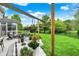 Landscaped backyard with seating, flowers and green lawn, perfect for enjoying the outdoors at 7248 River Birch Ln, Indianapolis, IN 46236