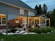 Inviting backyard patio features stylish shade and string lights perfect for outdoor entertaining and relaxation at 7248 River Birch Ln, Indianapolis, IN 46236