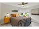 This cozy bedroom is well-lit and features a metal bed frame, plush bedding, and a bright yellow bedside table at 7248 River Birch Ln, Indianapolis, IN 46236