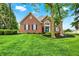 Beautiful brick home with lush green lawn and well-maintained landscaping at 7248 River Birch Ln, Indianapolis, IN 46236