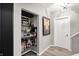 Hallway with built-in shelving that showcases unique memorabilia and decor, adding character to the space at 7248 River Birch Ln, Indianapolis, IN 46236