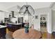 Breakfast nook and kitchen with stainless steel appliances, and view to backyard and laundry at 7248 River Birch Ln, Indianapolis, IN 46236