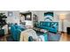 Bright living room featuring blue accent furniture, decorative pillows and modern decor at 7248 River Birch Ln, Indianapolis, IN 46236