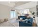 Cozy living room with a large sectional sofa, modern decor, and a view to the kitchen at 7248 River Birch Ln, Indianapolis, IN 46236