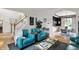 Bright and inviting living room with stylish seating and open staircase at 7248 River Birch Ln, Indianapolis, IN 46236