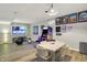 Spacious living room with an arcade game, a dining table, exercise equipment and recessed lighting at 7248 River Birch Ln, Indianapolis, IN 46236