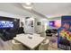 Spacious living room with an arcade game, a dining table, theater seating and recessed lighting at 7248 River Birch Ln, Indianapolis, IN 46236