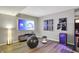 Spacious living room with an arcade game, exercise equipment, and recessed lighting at 7248 River Birch Ln, Indianapolis, IN 46236