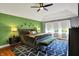 Stylish main bedroom featuring a statement wall, a plush bed, designer rug, and lots of light from windows at 7248 River Birch Ln, Indianapolis, IN 46236