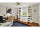 This home office includes custom bookshelves, natural light, and a built-in window seat for cozy study or work at 7248 River Birch Ln, Indianapolis, IN 46236