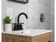Bathroom vanity featuring wood cabinets, white counter tops, and sleek matte black hardware at 8120 E 11Th St, Indianapolis, IN 46219