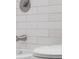Close up of a white bathtub with a white tile surround at 8120 E 11Th St, Indianapolis, IN 46219