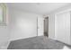 Inviting bedroom with neutral walls, plush carpeting and doorway to the rest of the house at 8120 E 11Th St, Indianapolis, IN 46219