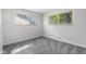 Cozy bedroom with natural light streaming through the windows, showcasing its comfortable atmosphere at 8120 E 11Th St, Indianapolis, IN 46219