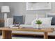 Close-up of the living room's decor, featuring stylish pillows and accessories on a wooden coffee table at 8120 E 11Th St, Indianapolis, IN 46219