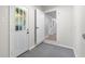View of the interior utility area with easy access to the back door and laundry hookups at 8120 E 11Th St, Indianapolis, IN 46219