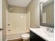 Clean bathroom features a tub-shower combination, toilet, and a modern vanity at 813 Stoner Dr, Anderson, IN 46013