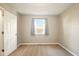 Cozy bedroom with neutral walls, carpet flooring, and a bright window at 813 Stoner Dr, Anderson, IN 46013