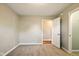 Clean and bright bedroom featuring carpet, fresh paint, and an open doorway to another room at 813 Stoner Dr, Anderson, IN 46013