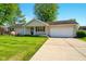 Charming ranch-style home with attached garage and well-maintained lawn, perfect for suburban living at 813 Stoner Dr, Anderson, IN 46013
