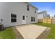 Backyard featuring a concrete patio and a well-manicured lawn surrounded by other houses at 8158 S Firefly Dr, Pendleton, IN 46064