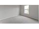 Cozy bedroom with neutral carpet and a window providing natural light at 8158 S Firefly Dr, Pendleton, IN 46064