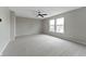 Spacious bedroom featuring neutral carpet, ceiling fan, and natural light from the windows at 8158 S Firefly Dr, Pendleton, IN 46064