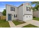Charming two-story home featuring a well-maintained lawn, a two-car garage, and blue front door at 8158 S Firefly Dr, Pendleton, IN 46064