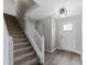 Bright foyer featuring wood floors, stairs and a modern light fixture at 8158 S Firefly Dr, Pendleton, IN 46064