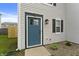A close up picture of a blue front door surrounded by stone landscaping at 8158 S Firefly Dr, Pendleton, IN 46064