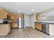A kitchen featuring stainless steel appliances, wood cabinets, and wood-look floors at 8158 S Firefly Dr, Pendleton, IN 46064