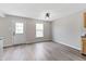Open kitchen features wood-look flooring, rear door, and large window at 8158 S Firefly Dr, Pendleton, IN 46064