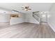 Open concept living room adjacent to the kitchen featuring hardwood floors at 8158 S Firefly Dr, Pendleton, IN 46064