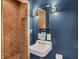 Modern bathroom with sink and shower, enhanced by stylish lighting fixtures at 8230 Linda Leigh Ln, Indianapolis, IN 46217