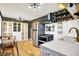 A beautifully updated kitchen with stainless steel appliances, subway tile, and wooden shelves at 8230 Linda Leigh Ln, Indianapolis, IN 46217